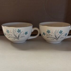 Classic White Porcelain Teacup with Teal Floral Accent